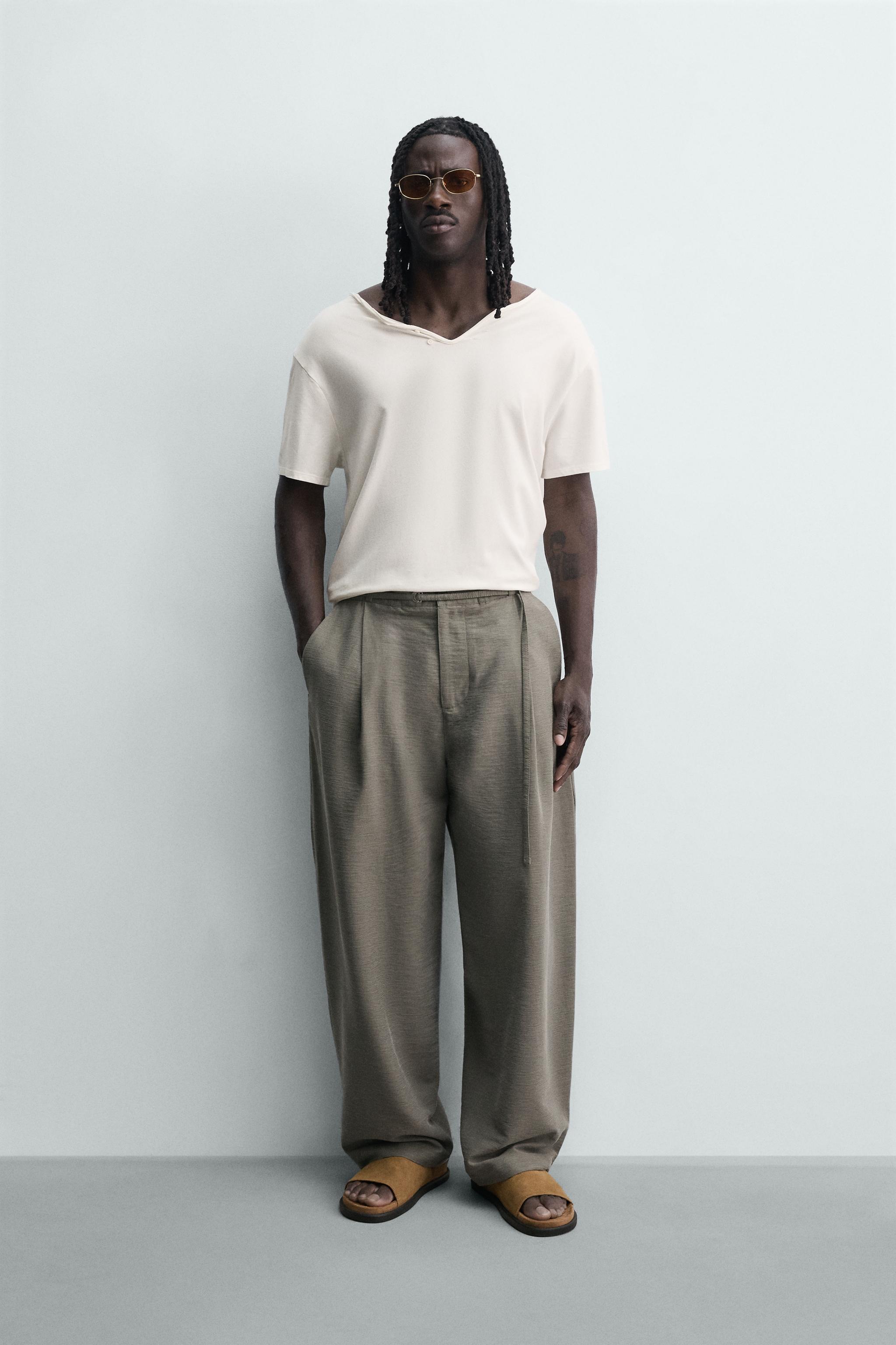 BALLOON FIT PLEATED BELTED PANTS